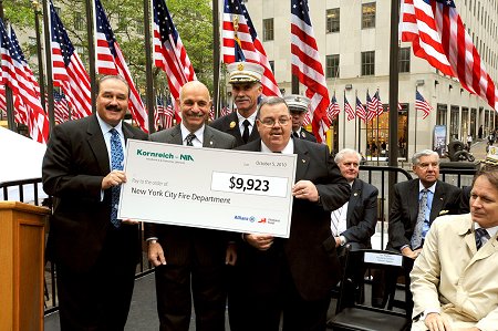 Kornreich Insurance and Fireman's Fund Insurance give the FDNY Foundation a $9,923 check for its fire safety efforts. (L to R) Steve Parnes of Kornreich Insurance; Fire Commissioner Salvatore Cassano; Terry McCormick of Fireman's Fund Insurance; and Chief of Department Edward Kilduff.