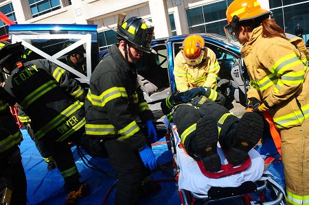Firefighters and EMS members demonstrate how they extract and treat a victim trapped in a vehicle.