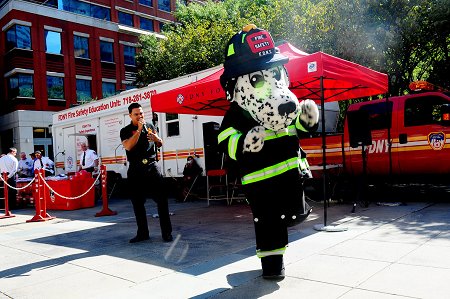 Hot Dog, the FDNY's fire safety mascot, dances to �ngel Alberto Crespo Ortiz's music. The singing/rapping firefighter from Puerto Rico sings fire safety songs for children.