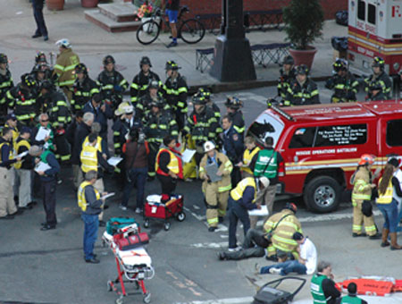 FDNY firefighters and EMS members arrive on the scene of the simulated car explosion.