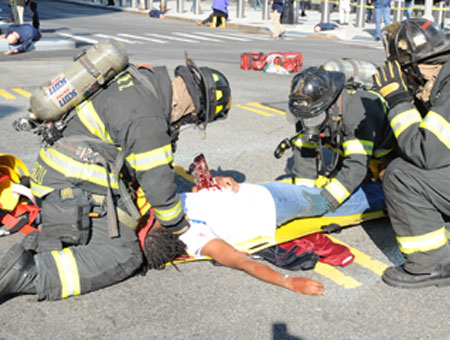 Firefighters treat a 'victim' during the drill.