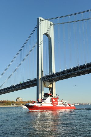 The Firefighter II passes under the Verrazano-Narrows Bridge when it arrives in New York on Nov. 13.