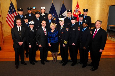 Caption: FDNY bone marrow and stem cell donors join FDNY and NYBC officials in front of the Honor Roll of Life plaque, including Lt. Michele Fitzsimmons (second from left, front row), Director of the FDNY's Health Service Bureau Mary T. McLaughlin (fourth from left, front row), and Firefighter Owen Fay (third from right, front row).