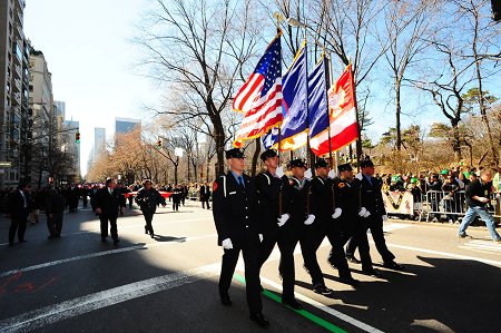 The FDNY Color Guard marches up Fifth Avenue.
