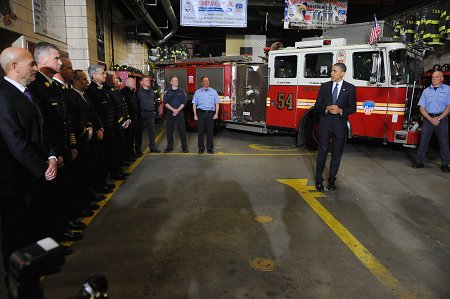 President Obama addresses all members present on the firehouse apparatus floor.