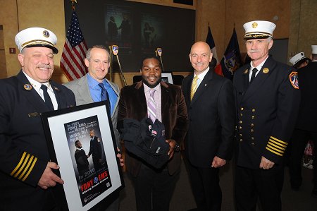 Survivor Bryan Lindsay (Paramedic Rowan Allen was unable to attend the event) with (L to R) Chief of EMS Abdo Nahmod, First Deputy Commissioner Don Shacknai, Fire Commissioner Salvatore Cassano and Chief of Department Edward Kilduff