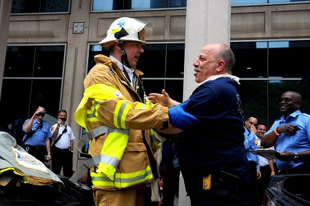EMS Chief Abdo Nahmod plays the 'hostage' in the scenario for the team of chiefs, and Chief Michael Fitton jokingly pushed him back in the vehicle. This is the first year a team of chiefs has participated in the Competition.