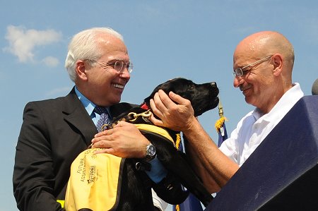 Fire Commissioner Salvatore Cassano and CEO of the Guide Dog Foundation for the Blind Wells Jones with the puppy named to honor FDNY members. Commissioner Cassano named her �Bravest� during the ceremony.