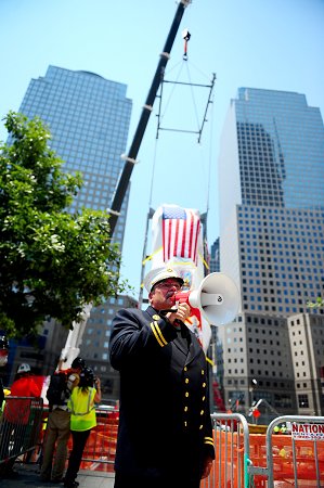 Monsignor John Delendick offers a prayer during the solemn tribute ceremony.