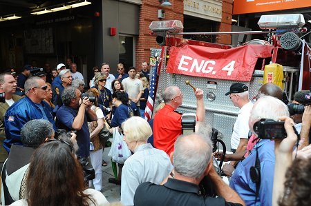 An apparatus is dedicated in Father Judge's name outside his Church. The apparatus will be donated to a firehouse in Peru.