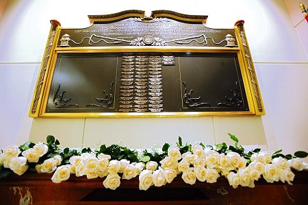 The Memorial Wall honoring the 55 members who have died as a result of World Trade Center-related illnesses. It hangs in the lobby of FDNY Headquarters.