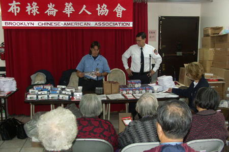 Seniors at the Chinese American Association learn about fire safety tailored to their needs.