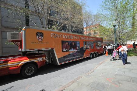 Mobile Fire Safety Experience trailer with windows for viewing home fire hazards and fire simulation.