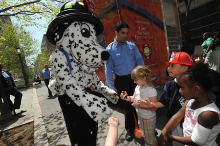 HotDog greets children during community event.