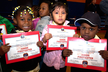 Schoolchildren receive Junior Firefighter certification after Training.