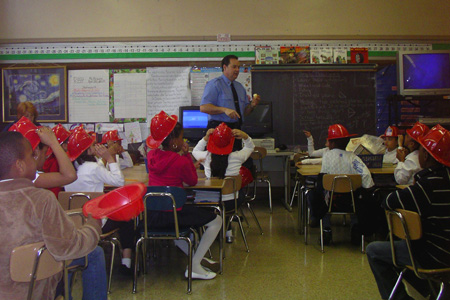 Fire safety educator discusses candle safety with children.