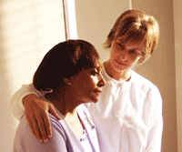 Social worker helps patient.