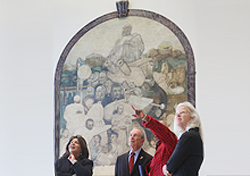 Mayor Bloomberg, Senior VP Jimenez-Hernandez and Deputy Mayor Gibbs in front of the mural 'Modern Medicine' (1940) by Charles Alston, as Exec. Dir. Soares points to another mural. Mayor Bloomberg, Senior VP Jimenez-Hernandez and Deputy Mayor Gibbs in front of the mural 'Modern Medicine' (1940) by Charles Alston, as Exec. Dir. Soares points to another mural.