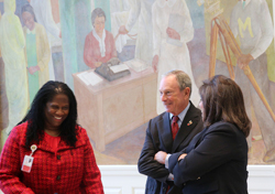 Mayor Bloomberg with Denise Soares and Iris Jimenez-Hernandez in front of the mural 'Pursuit of Happiness' by Vertis Hayes