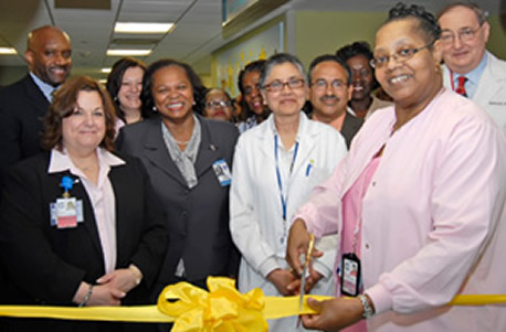 Dorothy Johnson, Head Nurse, cuts the ribbon for the Metropolitan Hospital new pediatric unit. She was joined by, L to R, Gregory A. Atwater, Deputy Exec. Dir.; Meryl Weinberg, Exec. Dir.; Lillian Diaz, Chief Nurse Exec.; Lynda D. Curtis, HHC Sr. VP; Dr. Sarla Inamdar, Chief of Pediatrics; Hector Mazara, Sr. Assoc. Dir.,Capital Design; Dr. Richard K. Stone, Medical Director. Dorothy Johnson, Head Nurse, cuts the ribbon for the Metropolitan Hospital new pediatric unit. She was joined by, L to R, Gregory A. Atwater, Deputy Exec. Dir.; Meryl Weinberg, Exec. Dir.; Lillian Diaz, Chief Nurse Exec.; Lynda D. Curtis, HHC Sr. VP; Dr. Sarla Inamdar, Chief of Pediatrics; Hector Mazara, Sr. Assoc. Dir.,Capital Design; Dr. Richard K. Stone, Medical Director.
