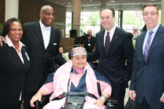 Coler-Goldwater resident Vesahida Rodriguez, center, who received a power wheelchair, with, L to R, Lynda D. Curtis, HHC Senior VP; Hank Carter, Chairman and Founder of WCI; Alan D. Aviles, HHC President; and Robert Hughes, Executive Director, Coler-Goldwater Coler-Goldwater resident Vesahida Rodriguez, center, who received a power wheelchair, with, L to R, Lynda D. Curtis, HHC Senior VP; Hank Carter, Chairman and Founder of WCI; Alan D. Aviles, HHC President; and Robert Hughes, Executive Director, Coler-Goldwater