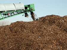 photo: a trommel depositing screened material into a windrow