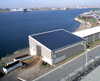Rikers Island compost facility features a translucent photovoltaic panel roofing system
