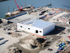 image: An aerial view showing the completion of the bale building's roof