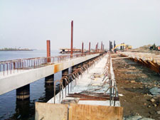 image: Concrete slabs with rebar are fitted over the posts