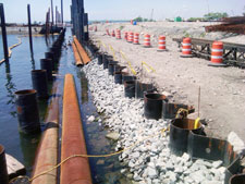 image: Outer steel posts are set into the water