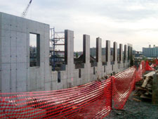 image: The storage building wall is outfitted with eight loading docks for outbound shipments of plastic, cartons, & aluminum bales