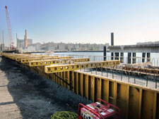 image: Pile caps line the dock. At this stage, all in-water pile driving is complete