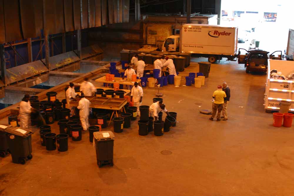 photo: Workers sorting samples of NYC's waste into different material categories.