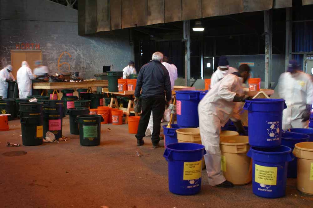 photo: Workers sorting samples of NYC's waste into different material categories.
