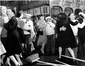 Broadway showgirls dancing with Department of Sanitation street sweepers at Broadway and 46th Street, 1940.