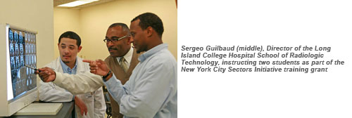 Sergeo Guilbaud (middle), Director of the Long Island College Hospital School of Radiologic Technology, instructing two students as part of the New York City Sectors Initiative training grant.