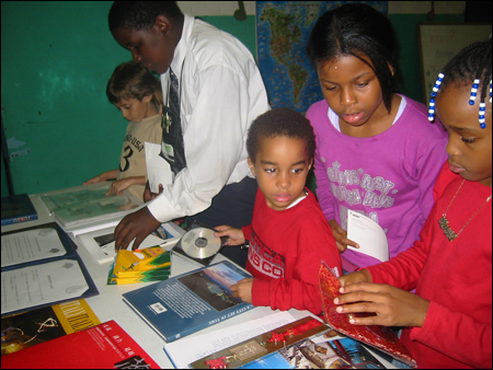 IEEP student participants browsing through materials about New York City's sister cities at student orientation