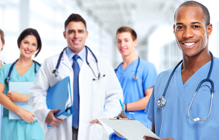 A doctor with a clipboard looks at the camera and smiles
                                           