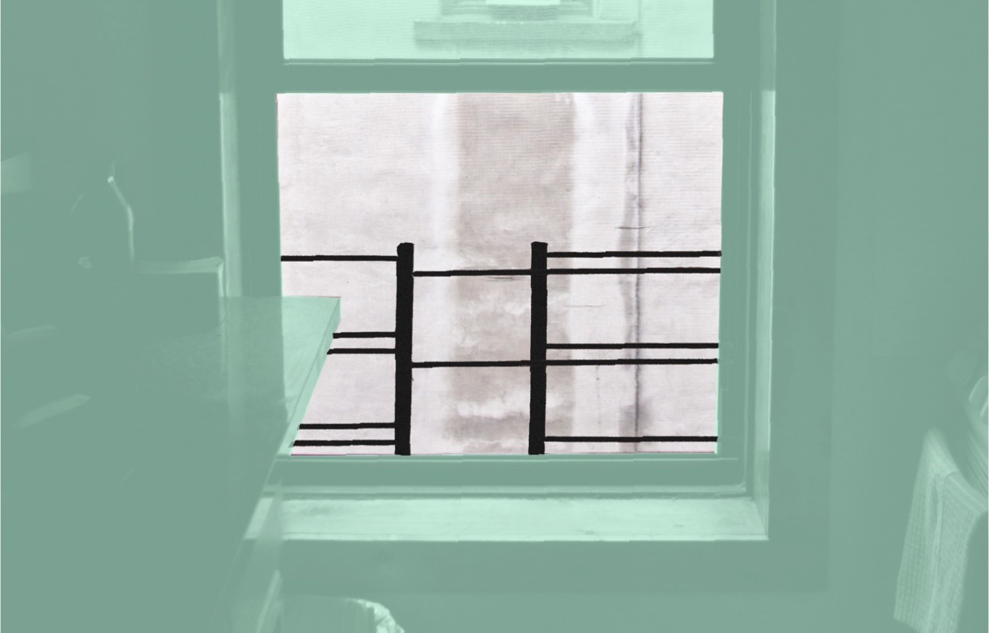 a window with a black guard
                                           