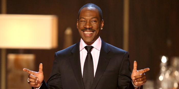 Photo of Eddie Murphy smiling and pointing with two hands