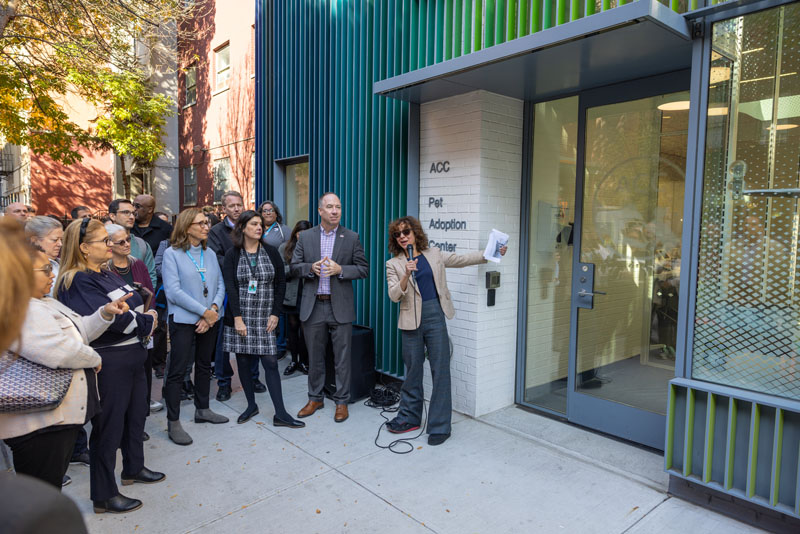 Deputy Mayor of Operations Meera Joshi speaking outside the new Manhattan Pet Adoption Center as city officials and ACC leaders look on.