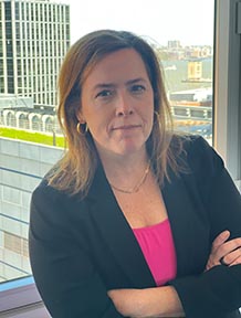 Headshot of Commissioner Elizabeth Crotty in front of a window 