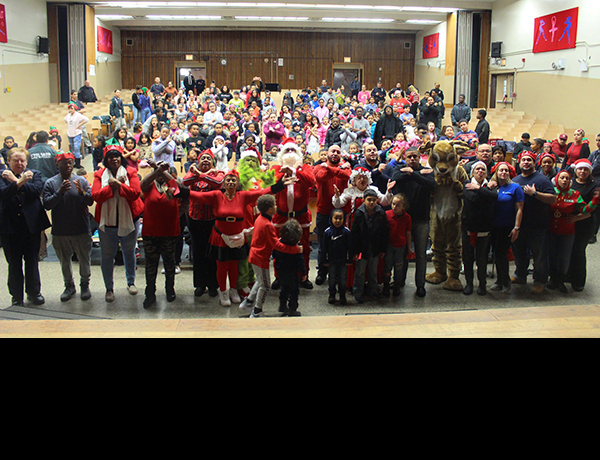 members of Bronx community board 2 posing in auditorium
                                           
