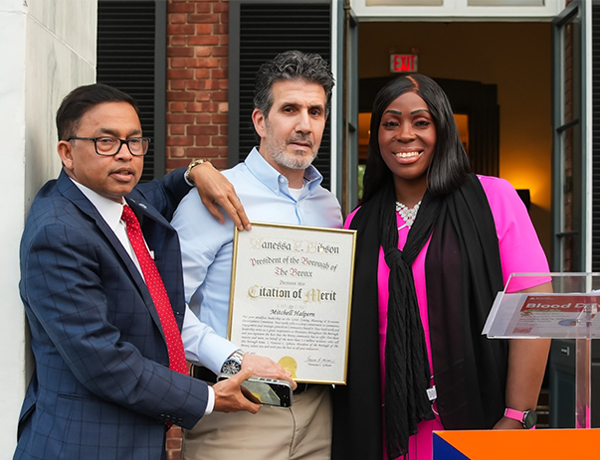 1st Vice Chair Mitchell Halpern (middle) presented with a Citation of Merit alongside Chairperson Mohammed Mujumder (left) and Bronx Borough President Vanessa Gibson (right).
                                           