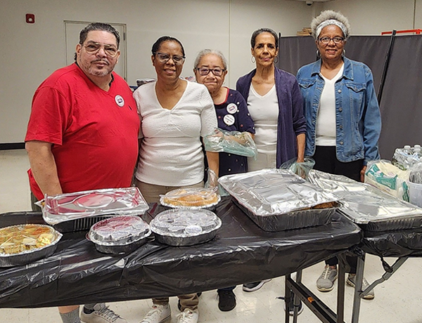 Bronx Community Board 9 volunteers assist with serving breakfast at Seniors Connected.

                                           