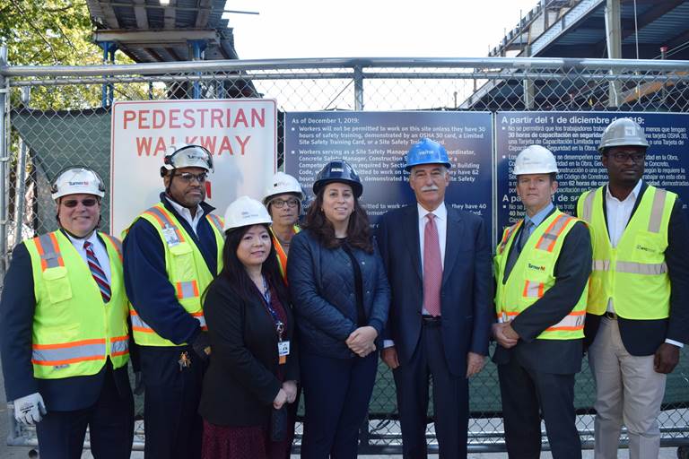 (Buildings Commissioner La Rocca, along with representatives from NYC Health + Hospitals/Coney Island, the Building Trades Employers Association, and Turner Construction Company, unveiling new multilingual construction worker safety training signs in Coney Island, Brooklyn.)