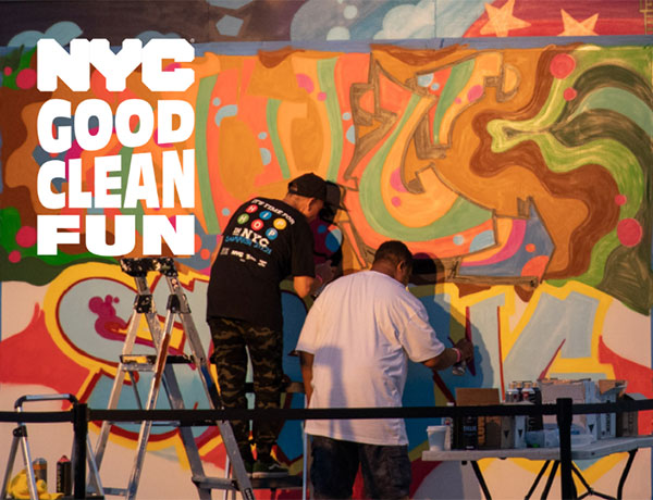 men painting a mural with Good Clean Fun logo
                                           