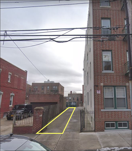 A street with buildings on either side

Description automatically generated with low confidence