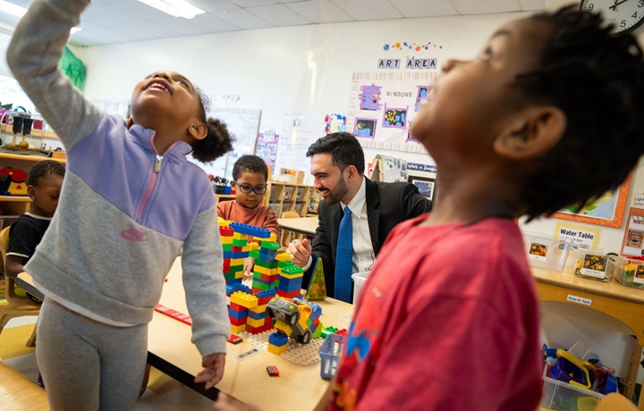 Photo of Mayor Mandani with children 
                                           
