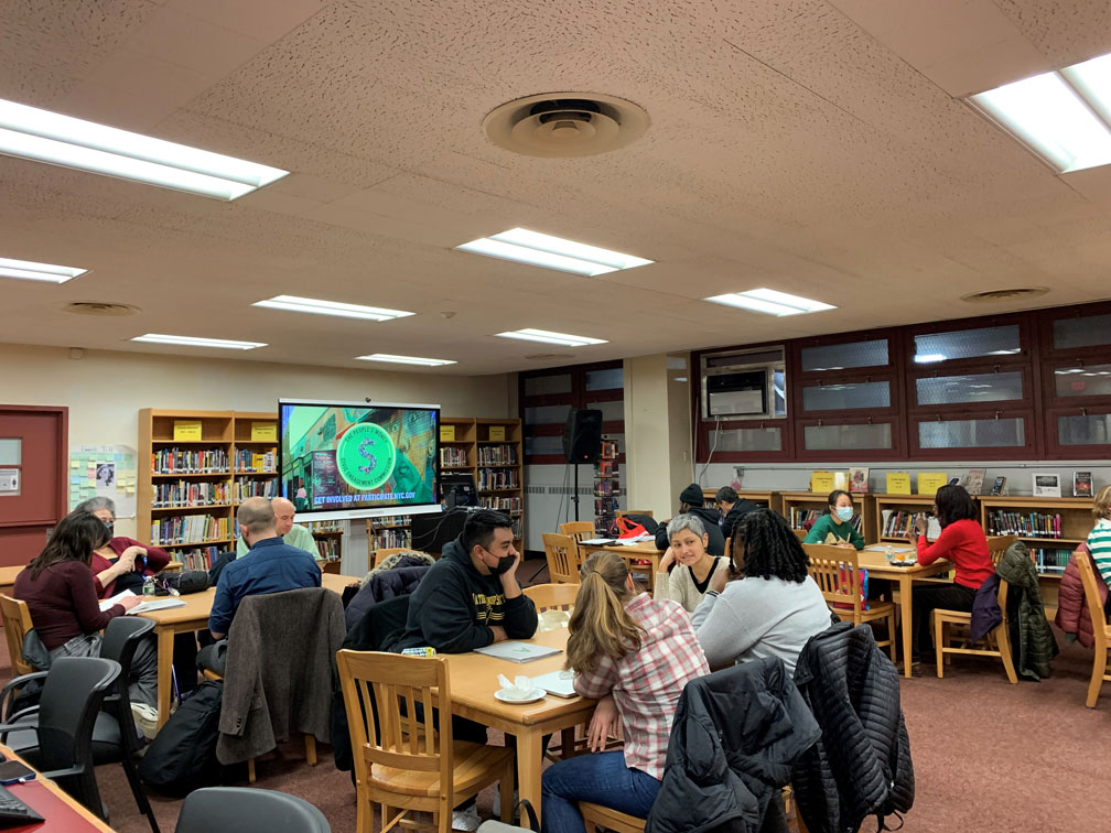 People sitting tables in a library